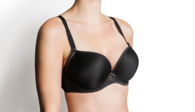 Black underwire bra with padded cups and adjustable straps displayed on a mannequin.