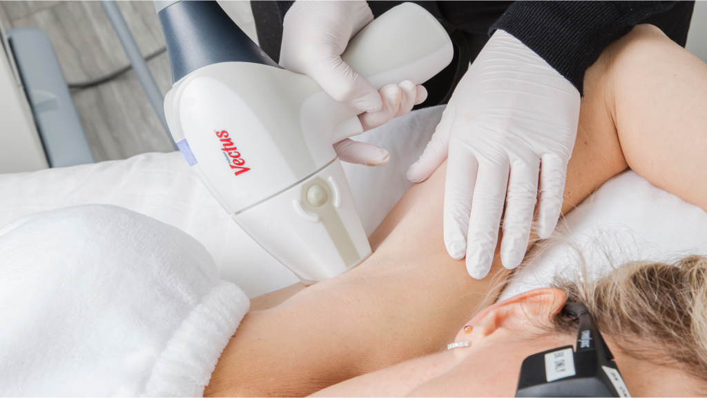 a woman receiving laser hair removal on armpit