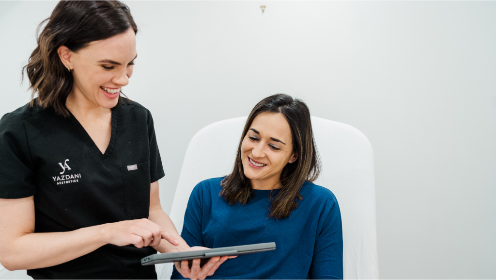 a provider consulting a patient about thread lifting on patient's face